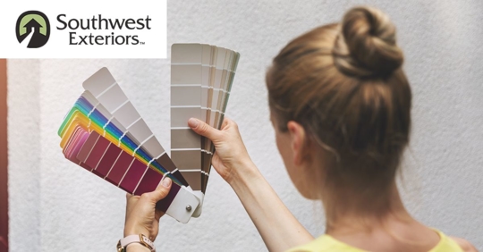 Woman browsing paint color swatches