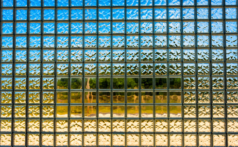 A close-up of a glass block window