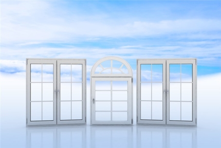 Three white windows, one arched, are positioned against a blue sky background.