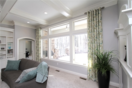 A bright living room with a large window is shown.