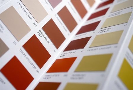 A close-up view of paint swatches on a brochure