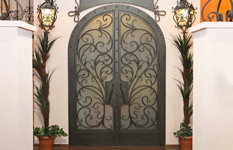 wrought iron double doors with a frosted glass backing