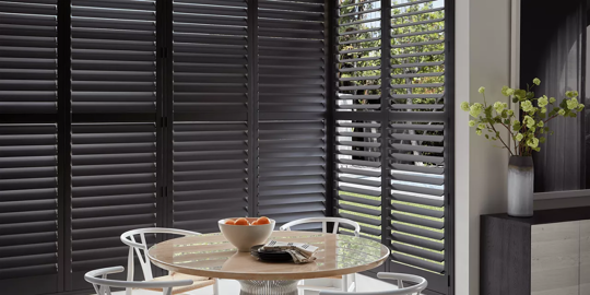 dark gray window shutters in a dining space