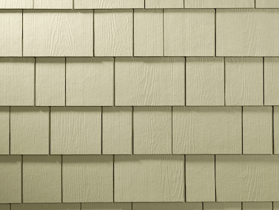 This image shows a section of pale green, shake-style siding.