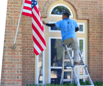 A man stands on a ladder