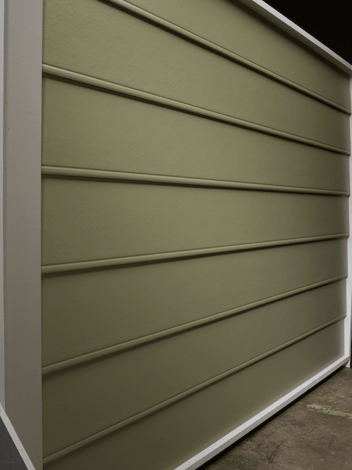 Beaded seam siding with a smooth finish in an olive green color. 