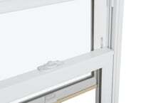 A close up of a white window with a white latch on the sash.