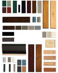 A layout of different types of wood finishes and colors for a window frame against a white backgroun…