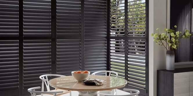 Hunter Douglas heritance shutter in a kitchen bay windows