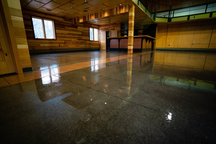 A clear metallic epoxy coating in a large event space. 