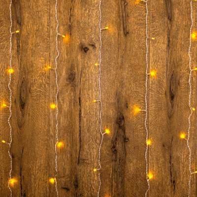 String lights against a wood panel background.