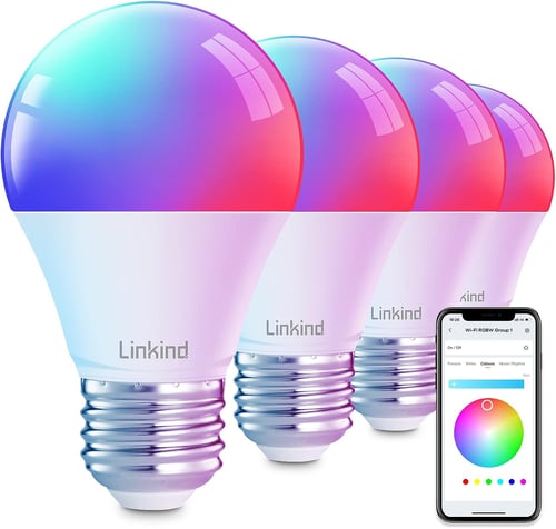 Four multicolored lightbulbs in a pack with an iPhone next to it. 