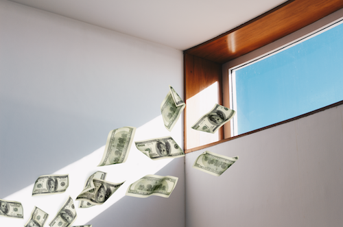 A rectangular window close to a ceiling with a red/brown trim and sunlight streaming in. There are graphics of money spilling out from the window. 