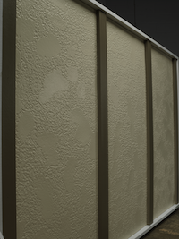A wall of stucco siding in a beige color with small brown batten boards laid vertically.