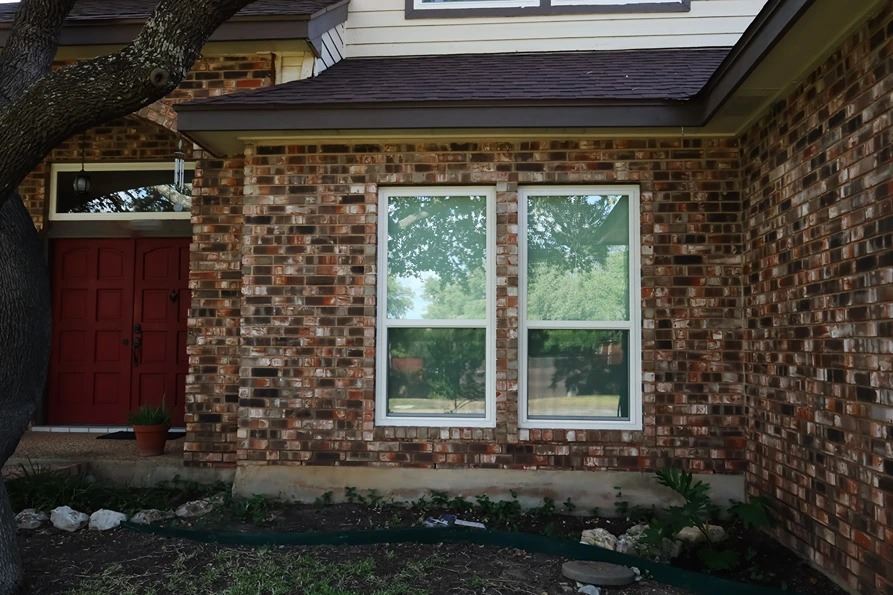 single hung window on brick exterior