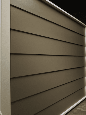 Smooth lap horizontal siding in a brownish green color.