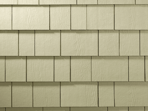 Close-up shot of straight-edge shingle siding in a beige color.